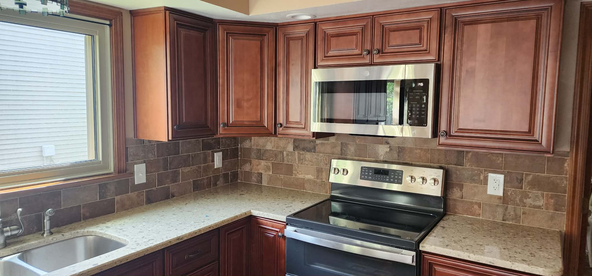 Cherry kitchen & granite corner