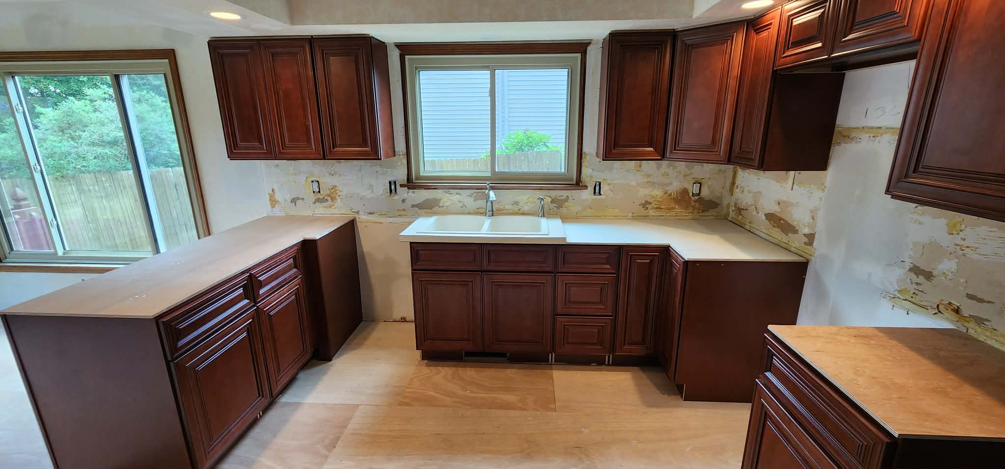 Kitchen remodel in progress — new cabinets in, backsplash and counters to come