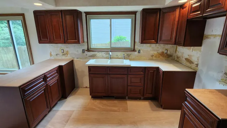 Kitchen remodel in progress — new cabinets in, backsplash and counters to come